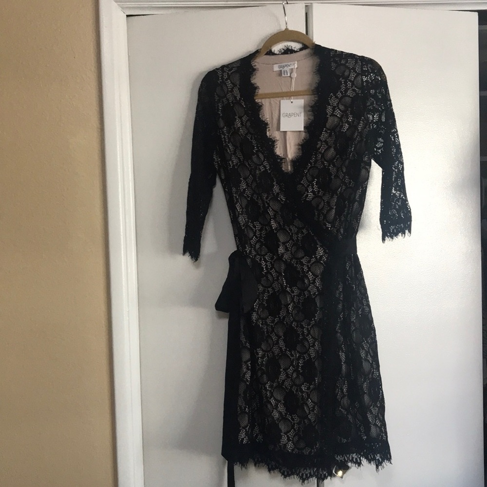 Black and beige lace wrap around dress